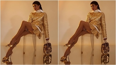 Jacqueline wore the jumper with a gold wool mini skirt decorated with a frilled silhouette and patterned knit details. She rounded it off with textured Valentino logo pumps and a top handle bag embellished with gold plates. (Instagram/@jacquelinef143)