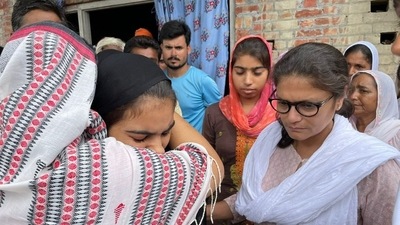 Sushmita Dev with Lakhimpur victims' families (Twitter/AITCOfficial) Sushmita Dev with Lakhimpur victims' families (Twitter/AITCOfficial)