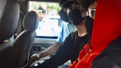 Aryan Khan (in black) after his arrest. Aryan Khan (in black) after his arrest. 