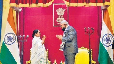 TMC chief Mamata Banerjee takes a gesture to Governor Jagdeep Dhankhar after taking oath as chief minister of West Bengal for a third consecutive term, at Raj Bhavan in Kolkata, on May 5. (ANI) TMC chief Mamata Banerjee takes a gesture to Governor Jagdeep Dhankhar after taking oath as chief minister of West Bengal for a third consecutive term, at Raj Bhavan in Kolkata, on May 5. (ANI)
