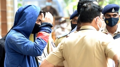 Bollywood actor Shah Rukh Khan's son Aryan Khan leaves the NCB office after an inquiry as he is arrested in an allegedly drug-related case, in Mumbai on Sunday. (ANI) Bollywood actor Shah Rukh Khan's son Aryan Khan leaves the NCB office after an inquiry as he is arrested in an allegedly drug-related case, in Mumbai on Sunday. (ANI)