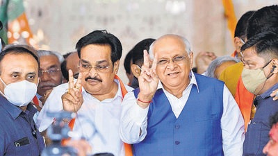 Gujarat chief minister Bhupendra Patel and state BJP president CR Patil show the victory sign after winning Gandhinagar Municipal Corporation Election, at BJP HQ in Gandhinagar, on Tuesday. (PTI) Gujarat chief minister Bhupendra Patel and state BJP president CR Patil show the victory sign after winning Gandhinagar Municipal Corporation Election, at BJP HQ in Gandhinagar, on Tuesday. (PTI)