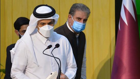 Pakistan's Foreign Minister Shah Mahmood Qureshi (R) and Qatar's Foreign Minister Sheikh Mohammed bin Abdulrahman al-Thani arrive to address a press conference in Islamabad (AFP)