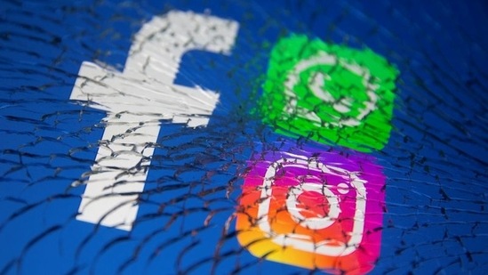 Facebook, WhatsApp and Instagram logos are displayed through broken glass in this illustration.(Reuters Photo)