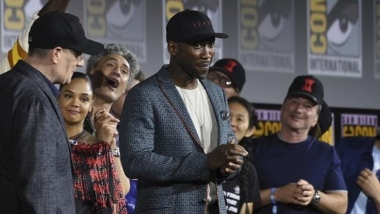 Mahershala Ali, centre, wears a hat to promote his new movie Blade at the Marvel Studios panel on day three of Comic-Con International on July 20, 2019, in San Diego.(Chris Pizzello/Invision/AP)