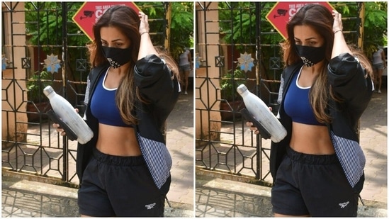 Malaika carried a white water bottle in one hand as she passed the paparazzi on her way to the car. Needless to say, she made us stop and stare with her outfit of the day.(HT Photos/Varinder Chawla)