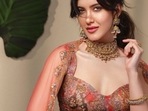 Shanaya Kapoor sizzles in a bold, red embellished box pleated lehenga set(Instagram/tanghavri) Shanaya Kapoor sizzles in a bold, red embellished box pleated lehenga set(Instagram/tanghavri)