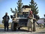 Taliban fighters working as a police force stand guard next to a Humvee vehicle at the entrance gate of a police district in Kabul. (File Photo / AFP) Taliban fighters working as a police force stand guard next to a Humvee vehicle at the entrance gate of a police district in Kabul. (File Photo / AFP)