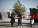 Taliban fighters working as a police force stand guard at the entrance gate of a police district in Kabul.(AFP Photo) Taliban fighters working as a police force stand guard at the entrance gate of a police district in Kabul.(AFP Photo)