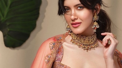 Shanaya Kapoor sizzles in a bold, red embellished box pleated lehenga set (Instagram/tanghavri) Shanaya Kapoor sizzles in a bold, red embellished box pleated lehenga set (Instagram/tanghavri)