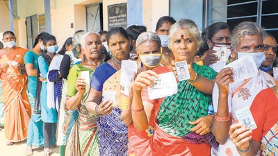 Voters stand in a queue to cast their vote for the rural local body polls of Tamil Nadu, in Vellore on Wednesday. (PTI) Voters stand in a queue to cast their vote for the rural local body polls of Tamil Nadu, in Vellore on Wednesday. (PTI)