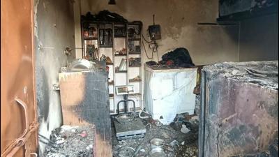 Fire department officials said a cooking gas leakage triggered a fire in a one-room house in Anand Parbat. A woman and her seven-year-old twins died in the blaze, police said. (HT Photo) Fire department officials said a cooking gas leakage triggered a fire in a one-room house in Anand Parbat. A woman and her seven-year-old twins died in the blaze, police said. (HT Photo)