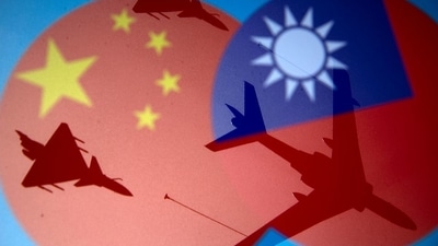 Chinese and Taiwanese national flags are displayed alongside military airplanes in this illustration. (REUTERS) Chinese and Taiwanese national flags are displayed alongside military airplanes in this illustration. (REUTERS)