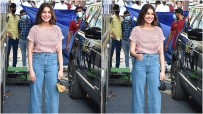 Anushka left her short tresses open in a middle parting with the outfit, and for glam, she went with soft smoky eye shadow, bold pink lip shade, blushed cheeks, glowing skin, and mascara-laden eyelashes. (HT Photo/Varinder Chawla)