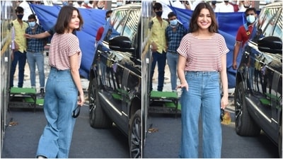 Anushka, who is married to cricketer Virat Kohli, opted to style the classic top and jeans combination in a minimal aesthetic. She ditched accessories with her ensemble and just wore a pair of chunky white sneakers and a black face mask with the look. (HT Photo/Varinder Chawla)