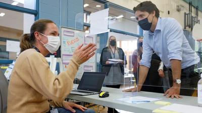 Canada’s Prime Minister Justin Trudeau visits a vaccination clinic in Ottawa, Ontario. Justin Trudeau has said that the Canadian government will enforce Covid vaccine mandate for public employees from October 30. (REUTERS) Canada’s Prime Minister Justin Trudeau visits a vaccination clinic in Ottawa, Ontario. Justin Trudeau has said that the Canadian government will enforce Covid vaccine mandate for public employees from October 30. (REUTERS)