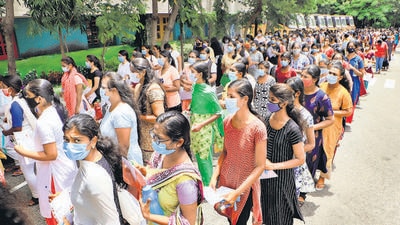 NEET aspirants queue outside an examination centre in Vellore on September 12. (PTI) NEET aspirants queue outside an examination centre in Vellore on September 12. (PTI)