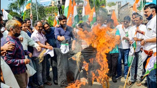 Party workers of Jharkhand Pradesh Congress Committee (JPCC) burn an effigy of Uttar Pradesh Chief Minister Yogi Adityanath in Ranchi as they protest against the house arrest of Congress General Secretary Priyanka Gandhi who was detained by Uttar Pradesh Police while on her way to Lakhimpur Kheri. (PTI PHOTO.)