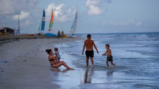 Tourists enjoy the beach at the Iberostar Selection Varadero hotel in Varadero, Cuba. Authorities in Cuba have begun to relax Covid restrictions in several cities like Havana and Varadero. (AP Photo/Ramon Espinosa) Tourists enjoy the beach at the Iberostar Selection Varadero hotel in Varadero, Cuba. Authorities in Cuba have begun to relax Covid restrictions in several cities like Havana and Varadero. (AP Photo/Ramon Espinosa)