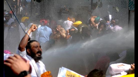 Chandigarh Police use water cannon to disperse AAP workers during the protest march against Lakhimpur Kheri incident at MLA on Wednesday. (Ravi Kumar/HT)
