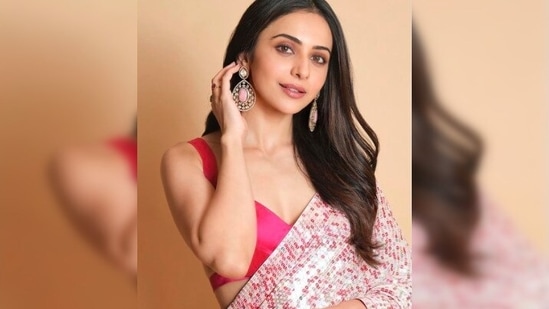 Rakul Preet accessorised her look with statement earrings and a stone ring.(Instagram/@rakulpreet)