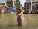 Arup Bera – a resident of Ward 2 of the Ghatal municipality area – was seen traversing the flooded streets near his home to offer ‘tarpan’ on Mahalaya&nbsp;