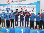 Men's Junior Trap team with their silver medal in the podium
