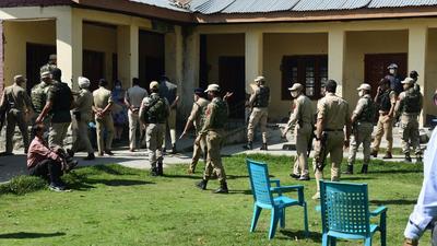 Security personnel cordoning off the government school where two teachers were allegedly killed by militants at Eidgah in Srinagar on Thursday. (ANI PHOTO.)