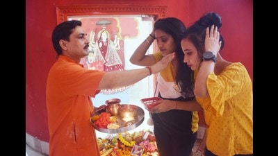 Devotees at Bhootnath temple in Lucknow. Many temples have arranged live streaming of ‘aarti’ via social media during Navratri and volunteers requested people to watch it on web. (Deepak Gupta/HT) Devotees at Bhootnath temple in Lucknow. Many temples have arranged live streaming of ‘aarti’ via social media during Navratri and volunteers requested people to watch it on web. (Deepak Gupta/HT)