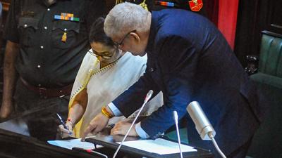 West Bengal governor Jagdeep Dhankhar with West Bengal chief minister Mamata Banerjee after she takes oath. (PTI Photo) West Bengal governor Jagdeep Dhankhar with West Bengal chief minister Mamata Banerjee after she takes oath. (PTI Photo)