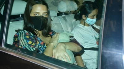 Neha Dhupia hides her son's face from the cameras. (Varinder Chawla. ) Neha Dhupia hides her son's face from the cameras. (Varinder Chawla. )