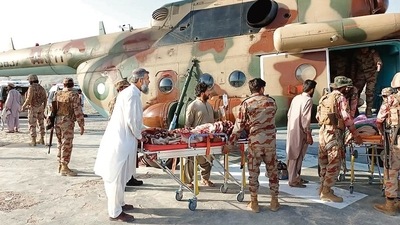 Injured survivors being transported in a Pakistan’s army helicopter following an earthquake in the remote mountainous district of Harnai in Balochistan. (Agencies)