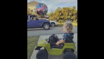This birthday boy waves at one of the jeep drivers in the video. Screengrab This birthday boy waves at one of the jeep drivers in the video. Screengrab