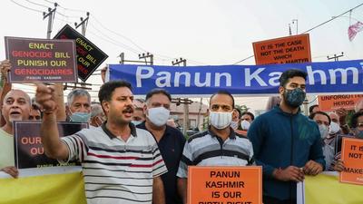 Members of Panun Kashmir shout slogans during a protest after militants shot dead two teachers in Srinagar's Eidgah Sangam area, in Jammu, on Thursday. (PTI)