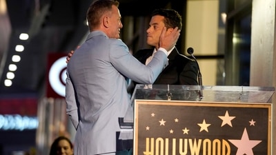 Rami Malek and Daniel Craig share a hug at the ceremony. Rami played the villain this time. (Chris Pizzello/Invision/AP)