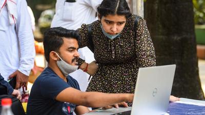 Students at a help desk at Delhi University's North campus on the second day of admissions for 2021-22, on Tuesday. A row erupted in the university over allegations that students from Kerala were being denied admission over flimsy grounds. (Amal KS/HT Photo) Students at a help desk at Delhi University's North campus on the second day of admissions for 2021-22, on Tuesday. A row erupted in the university over allegations that students from Kerala were being denied admission over flimsy grounds. (Amal KS/HT Photo)