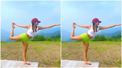 Janhvi, a fitness enthusiast, did not forget her workout sessions on her vacation. With the hills in the backdrop, she posed for a yoga position on a yoga mat. Dressed in a white cropped top and a neon green pair of shorts, she teamed her workout attire with a red cap. (Instagram/@janhvikapoor) Janhvi, a fitness enthusiast, did not forget her workout sessions on her vacation. With the hills in the backdrop, she posed for a yoga position on a yoga mat. Dressed in a white cropped top and a neon green pair of shorts, she teamed her workout attire with a red cap. (Instagram/@janhvikapoor)