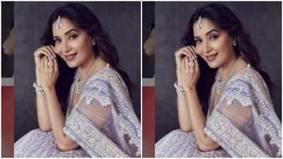 In a V-cut sleeveless blouse of the same fabric, Madhuri posed for the pictures. She teamed it with a long flowy skirt that is heavily embroidered in zari. With a satin dupatta intricately embroidered in white, Madhuri looked right out of a dream. (Instagram/@madhuridixitnene) In a V-cut sleeveless blouse of the same fabric, Madhuri posed for the pictures. She teamed it with a long flowy skirt that is heavily embroidered in zari. With a satin dupatta intricately embroidered in white, Madhuri looked right out of a dream. (Instagram/@madhuridixitnene)
