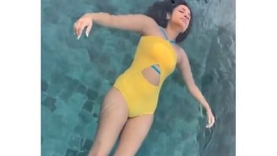 In a video shared on the Instagram, Parineeti was seen enjoying in the pool and flaunting her floating skills in another monokini look, this time a yellow monokini which contrasted brilliantly with her turquoise blue backdrop. The yellow monokini came with blue straps that wound around her neck and a triangular cutout detail featured on the waist to add to the oomph factor. (Instagram/parineetichopra)
