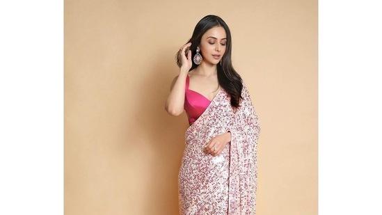 Rakul Preet goes bold this Navratri in Manish Malhotra's backless hot pink saree(Instagram/rakulpreet)