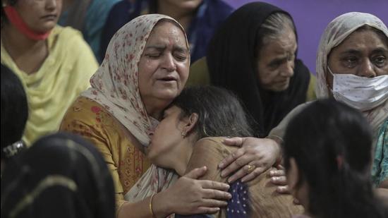 Relatives of Deepak Chand, the school teacher killed by terrorists on Thursday, mourn at their residence, in Jammu and Kashmir. School principal Satinder Kour was also killed in the terrorist attack. (AP)