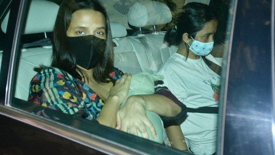 Neha Dhupia hides her son's face from the cameras. (Varinder Chawla. )