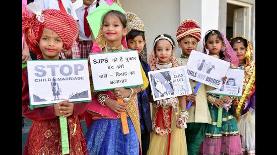School children take part in an awareness campaign to stop child marriage on 'Akshaya Tritiya' in Bikaner, Rajasthan. (PTI)