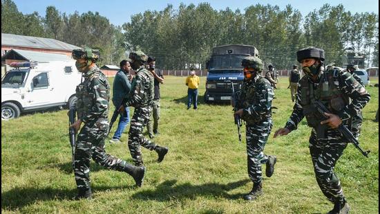 Security personnel arrive at Government Boys Higher Secondary School after terrorist shot dead two teachers at Eidgah Sangam area of Srinagar on Thursday. Terror attacks targeting minorities and non-locals in the Valley have revived memories of the exodus of minority communities that took place in Jammu and Kashmir in the early 1990s. (PTI)