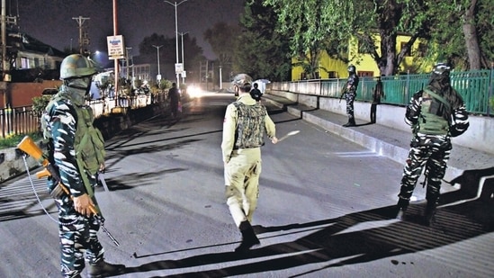 Security personnel cordon off area after a Kashmiri Pandit and owner of a popular pharmacy in Srinagar, Makhan Lal Bindroo, was shot by terrorists at Iqbal Park area in Srinagar on Tuesday. (ANI)