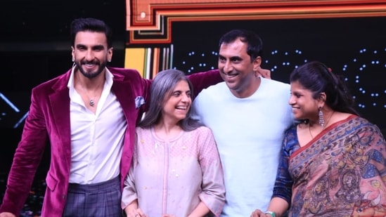 Ranveer and others posing for photos.