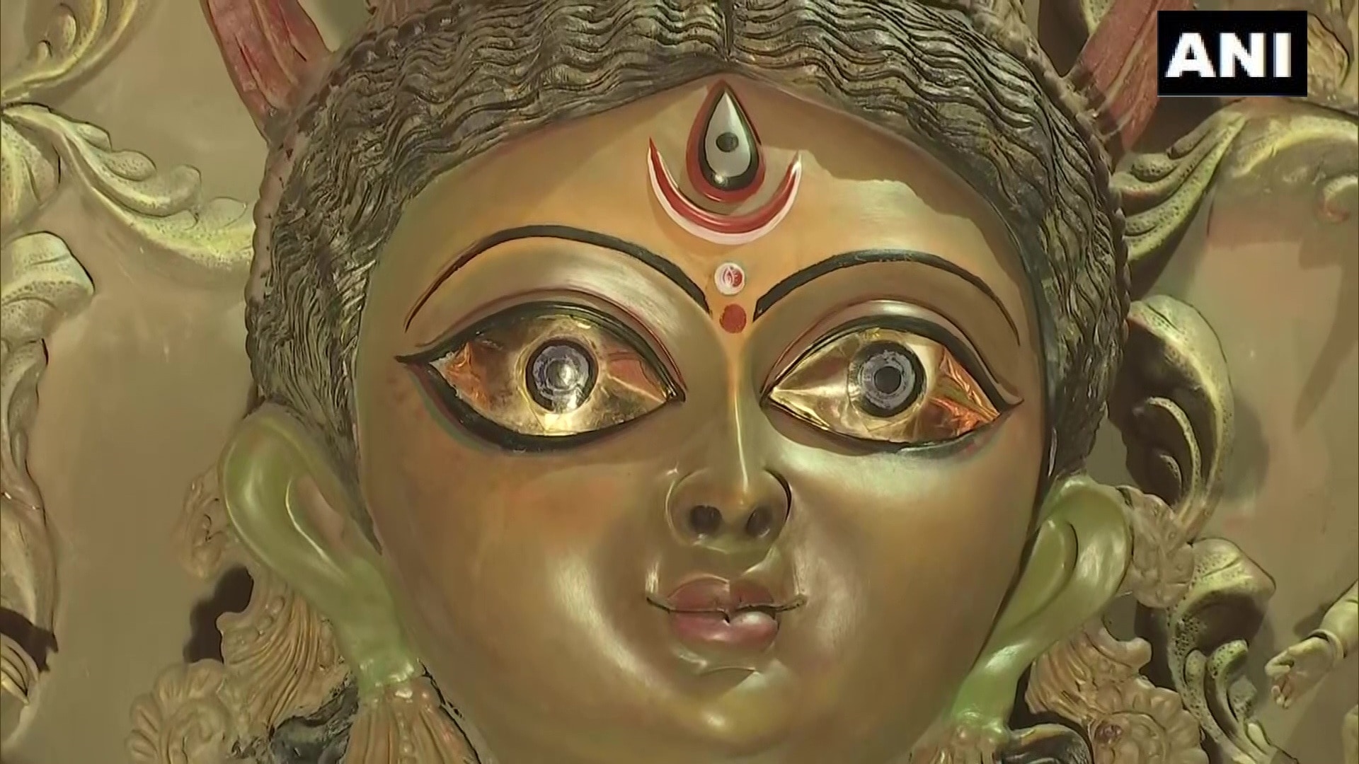 Durga idol with gold eyes at a pandal by Bandhu Mahal Club in Baguiati, Kolkata. (ANI)