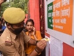 A police personnel pastes a notice outside Union minister Ajay Mishra's residence on Friday. (Deepak Gupta/HT Photo) A police personnel pastes a notice outside Union minister Ajay Mishra's residence on Friday. (Deepak Gupta/HT Photo)
