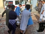 People carry the body of a bombing victim in Kunduz province, northern Afghanistan.(AP) People carry the body of a bombing victim in Kunduz province, northern Afghanistan.(AP)