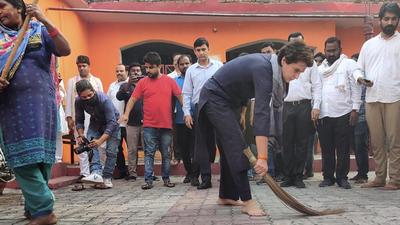 Congress general secretary Priyanka Gandhi Vadra wields the broom in the courtyard of a Valmiki temple in Lucknow after Yogi Adityanath took a swipe at her. (PTI Photo) Congress general secretary Priyanka Gandhi Vadra wields the broom in the courtyard of a Valmiki temple in Lucknow after Yogi Adityanath took a swipe at her. (PTI Photo)